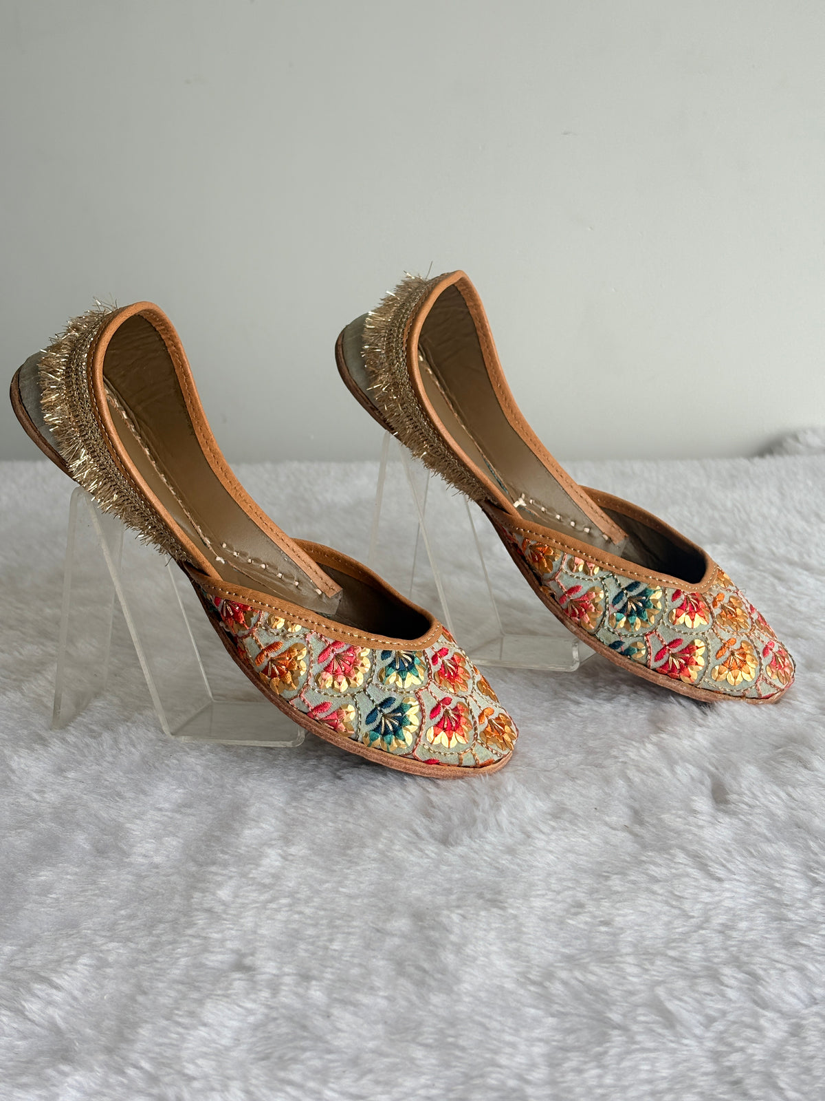 Rang Mahal Juttis with gold-toned heel fringe