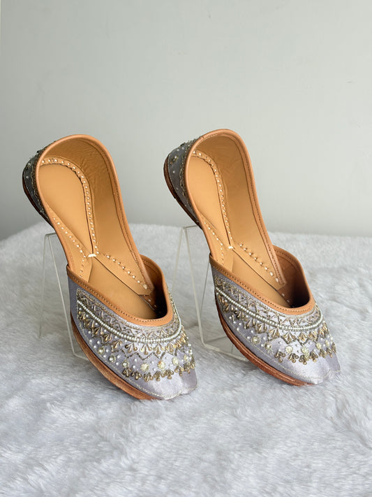 Zehra Silver Juttis front view with metallic embroidery and pearl-like beads