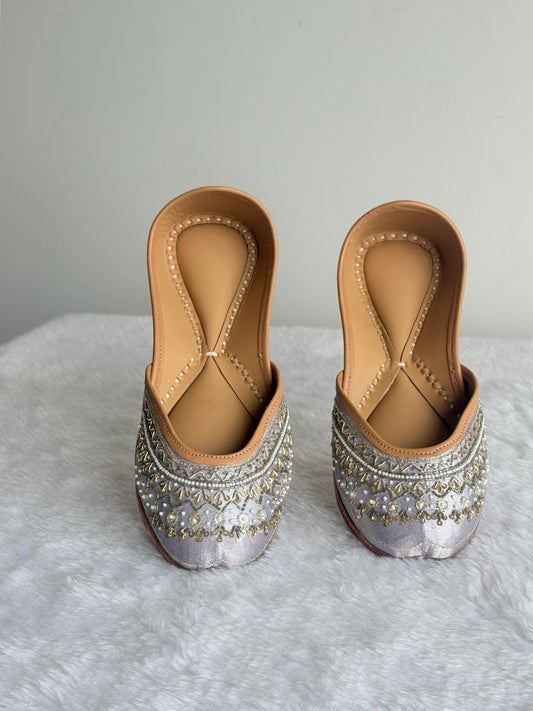 Angled view of Zehra Silver Juttis