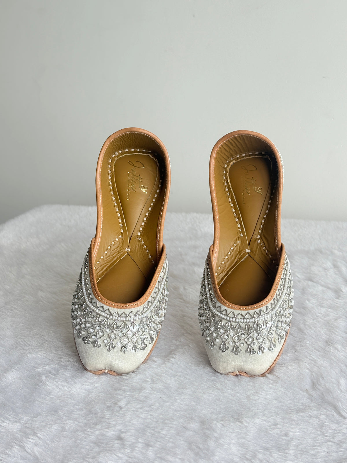 Chandni Silver Juttis showing embellished heels