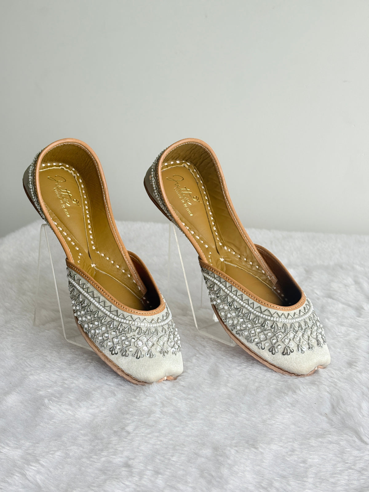 Chandni Silver Juttis pair showing detailed silver-toned embellishments