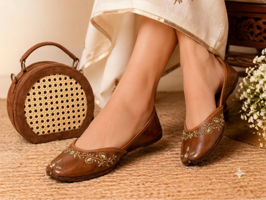 Sunehri Tan Juttis styled with an ivory outfit