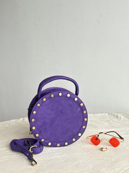 Purple studded round drum bag - front view with studs