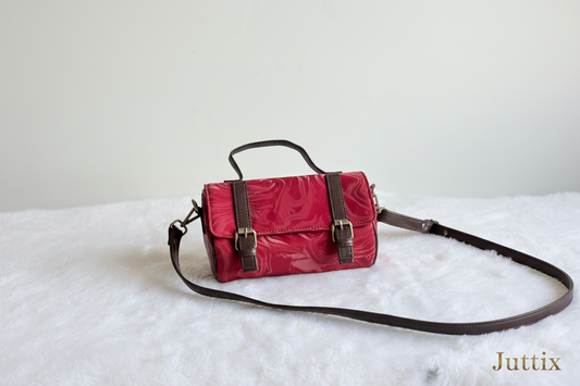 Red handbag with Juttix brand signature