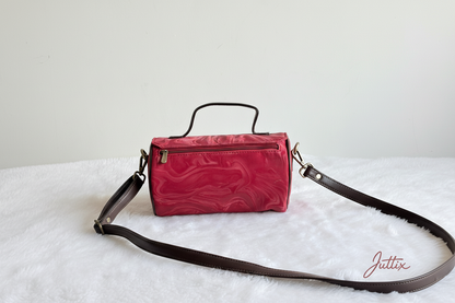 Red handbag with Juttix brand signature