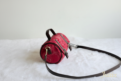 Red handbag with Juttix brand signature
