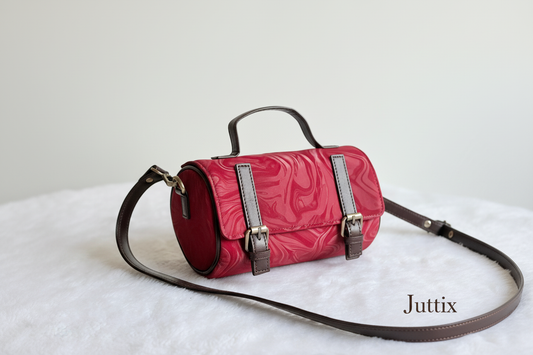 Red handbag with Juttix brand signature