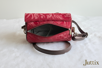 Red handbag with Juttix brand signature